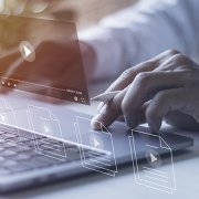 Businessman hands using laptops for streaming online on virtual screens, watching videos on the internet, live concert, show or tutorial, and content online. YouTube as Marketing Channel